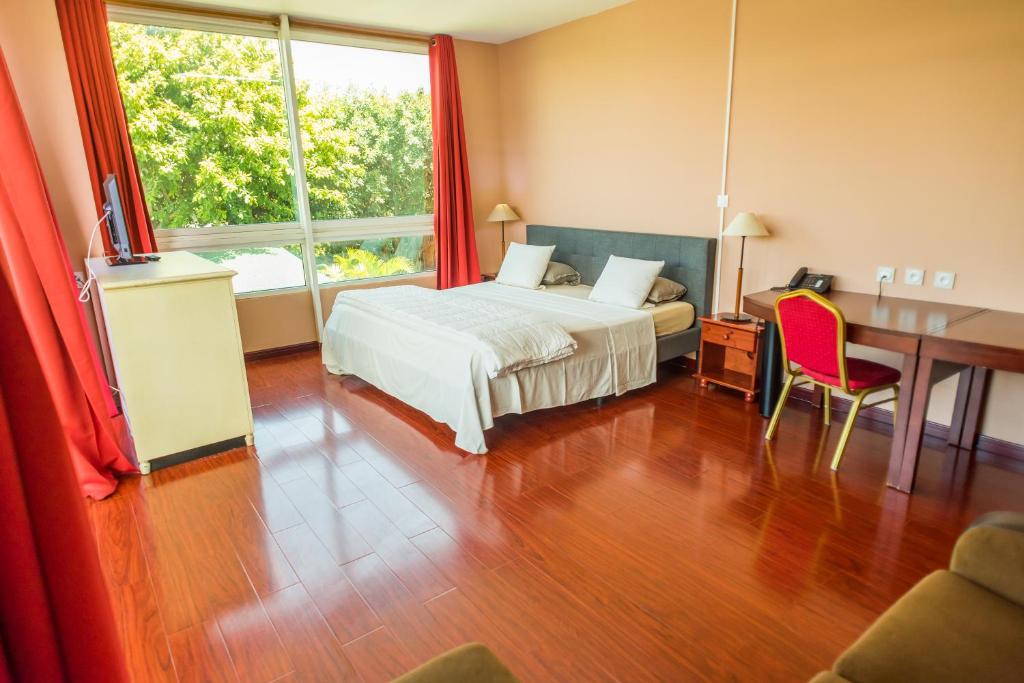 Bright hotel room with desk