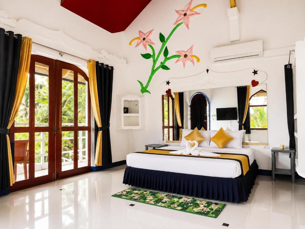 MG Chateau Resort guest room with hand-painted mural